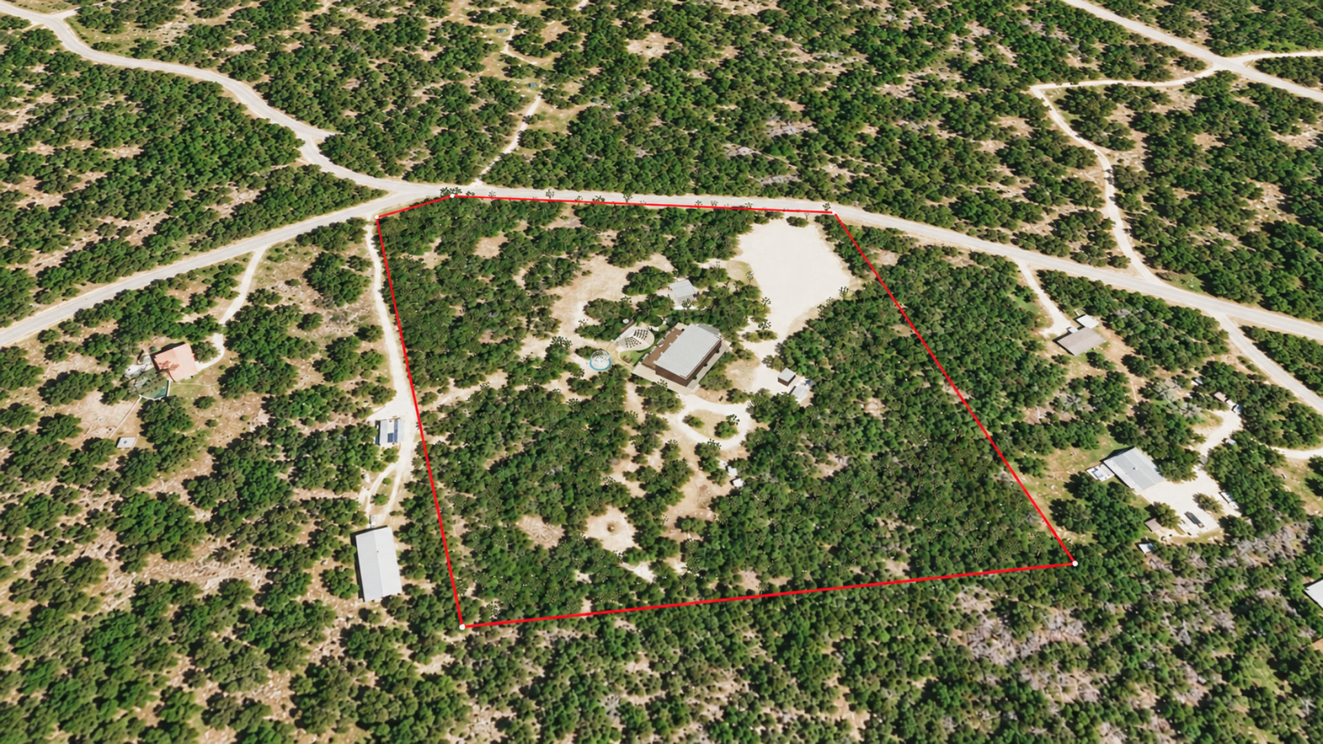 Matched existing-property aerial with the red parcel boundary